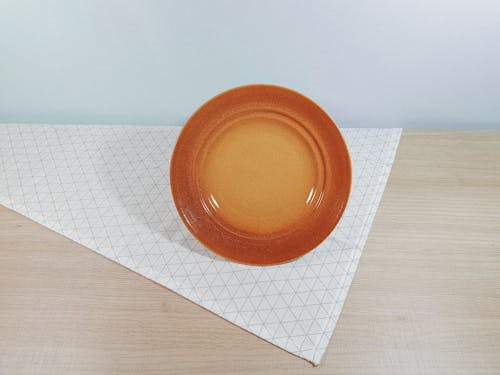 Brown Ceramic Plate on Table