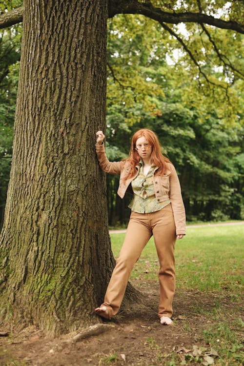 Woman Posing beside a Tree