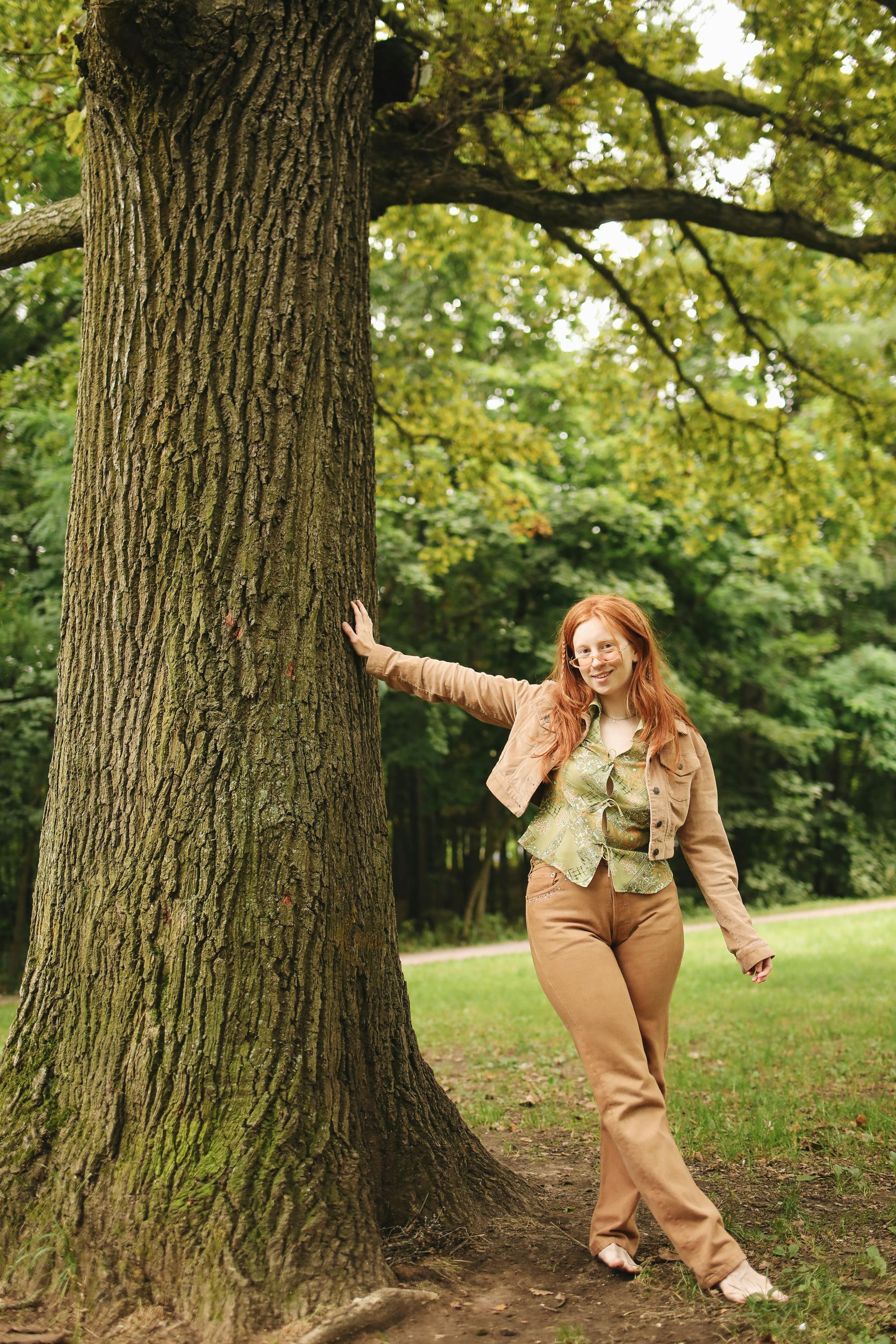 Woman Standing on One Leg in front of a Tree · Free Stock Photo