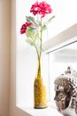 Red and Yellow Tulips in Yellow Glass Vase