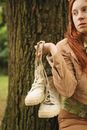 Woman in Beige Coat Holding White Leather Bag