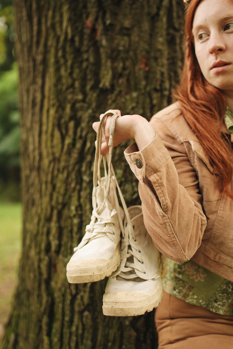 Woman Carrying White Shoes