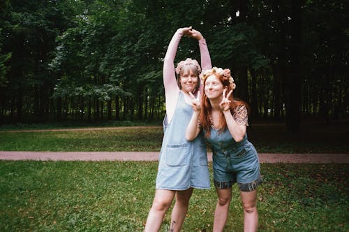 Women Standing Near Green Trees