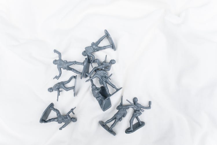 Toy Soldiers On White Sheet