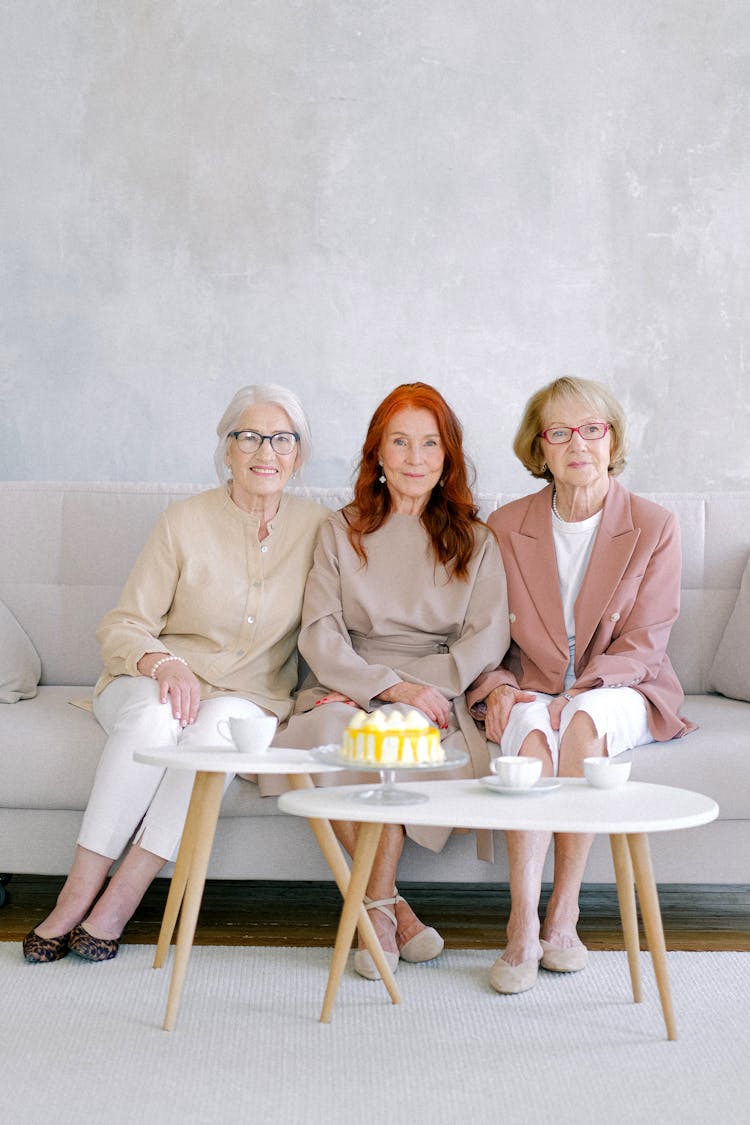 Aged Elegant Women Having Teatime With Sweet Cake