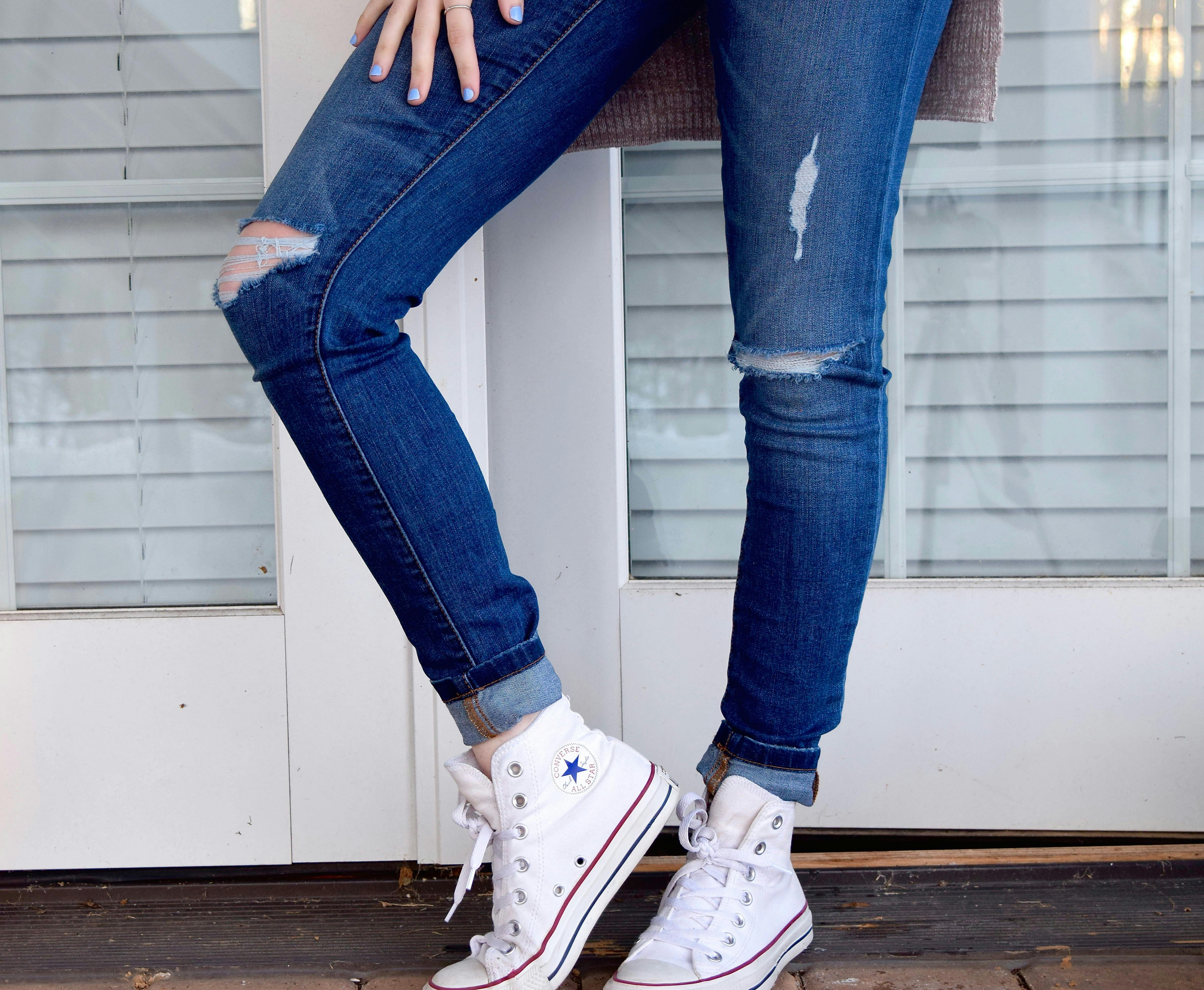 Person in Blue Denim Jeans and White Converse All Stars · Free Stock Photo