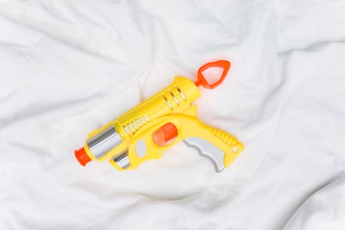 Yellow and Orange Plastic Toy Gun