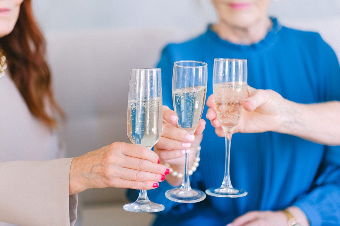 Senior women clinking glasses of champagne