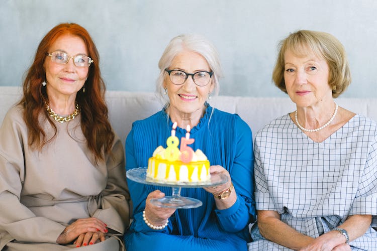 Happy Elderly Women With Birthday Cake