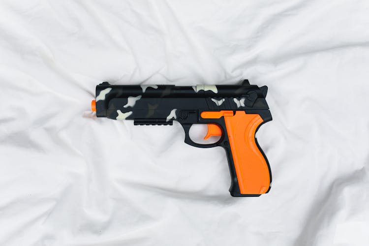 Toy Gun On White Background