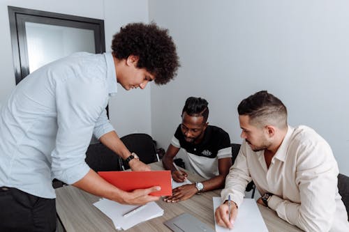 Free Men Brainstorming in the Office Stock Photo
