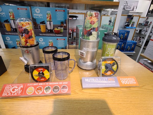 Dutch couple on the couch looking at a laptop together