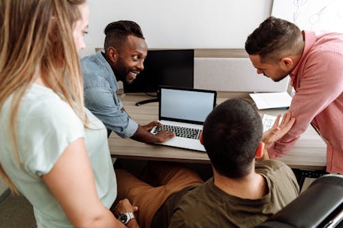 Free Group Of People Having Discussion At Work Stock Photo