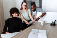 Woman in Green Tank Top Beside Man in Black Crew Neck T-shirt