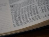 White Book Page on Brown Wooden Table