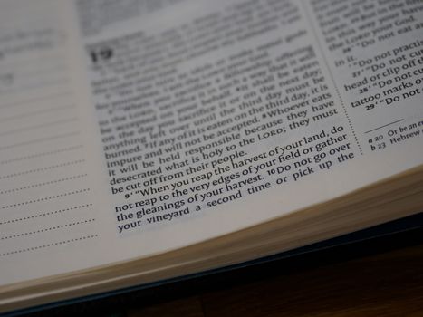 White Book Page on Brown Wooden Table