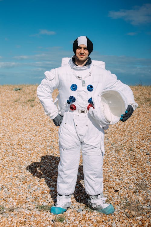 Man Standing On A Field Wearing A Costume