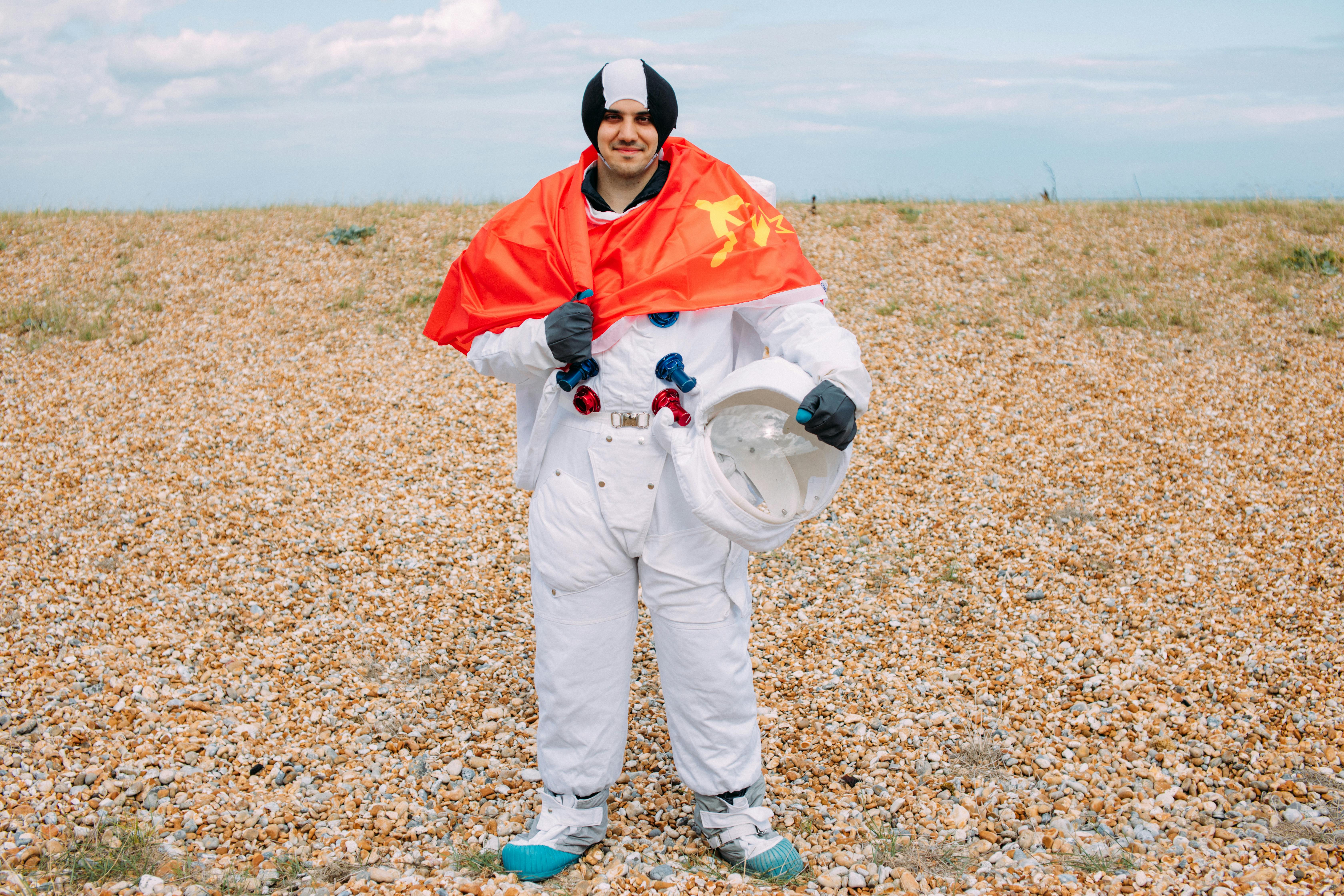 man in a costume in the middle of a desert