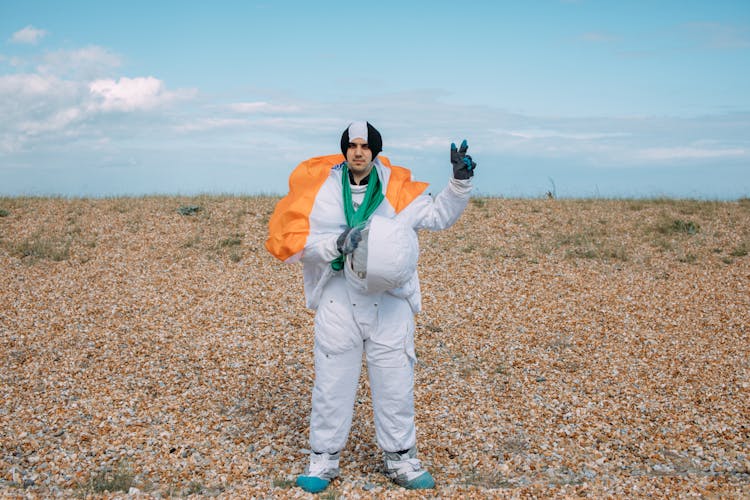 Man In An Astronaut Costume Doing A Peace Sign