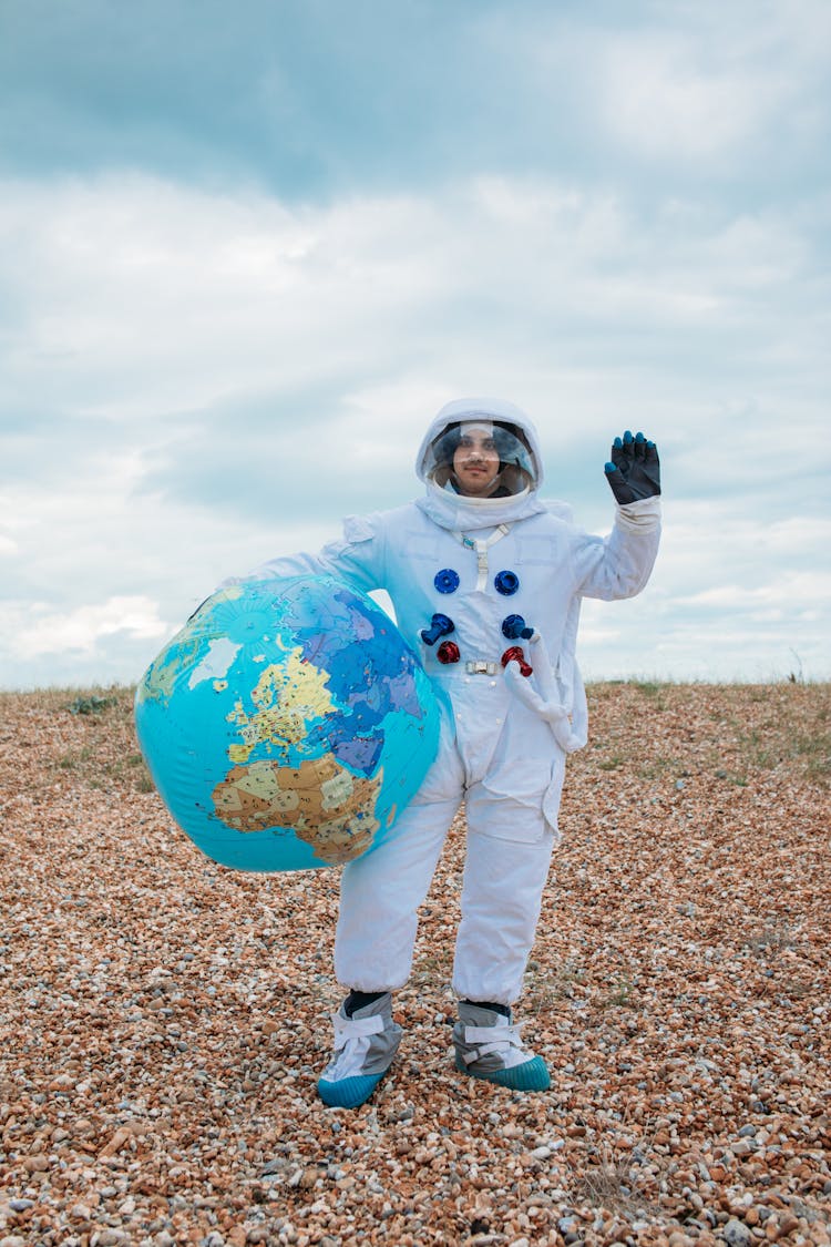 Astronaut With A Planet Earth Ball