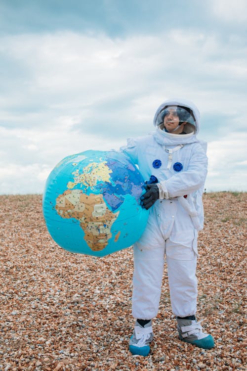 Astronaut Holding A Globe
