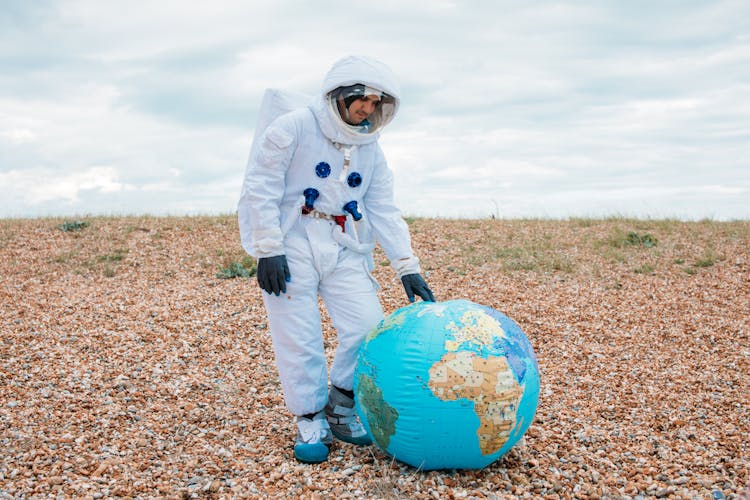 Astronaut With A Planet Earth Ball