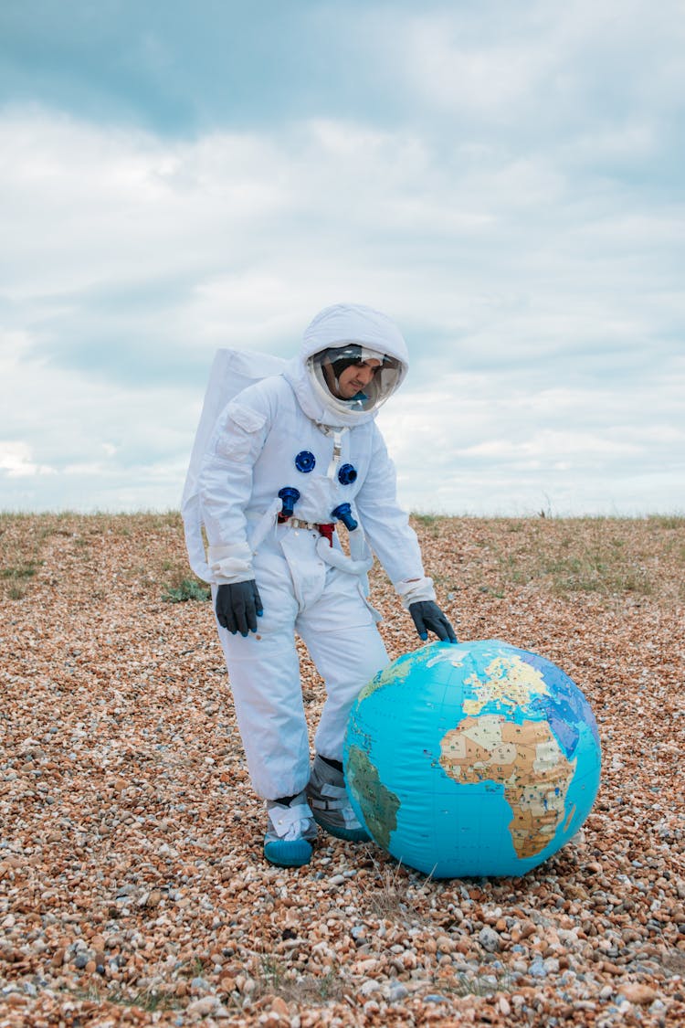 Astronaut With A Planet Earth Ball