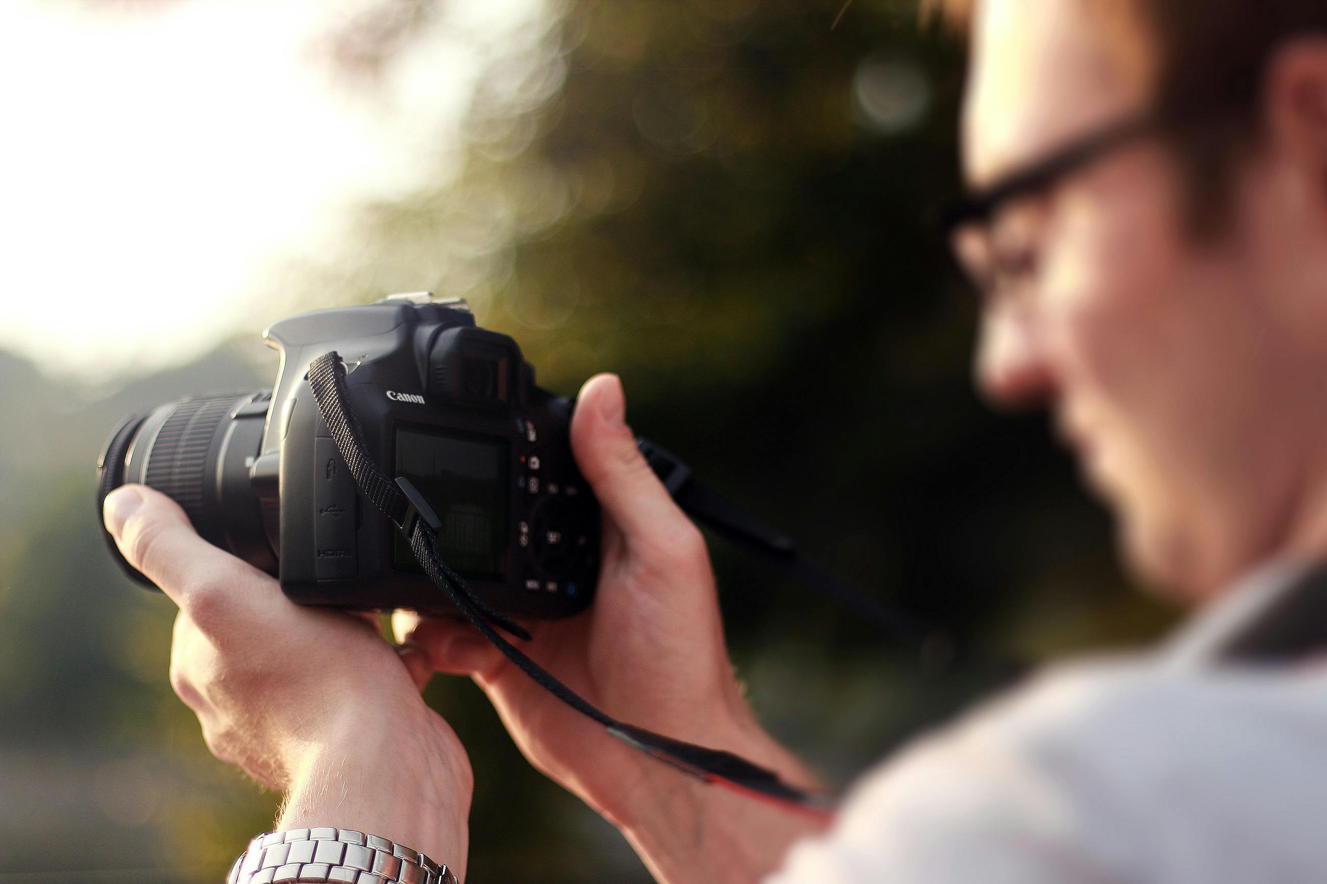 Person Holding Camera during Day Time \u00b7 Free Stock Photo