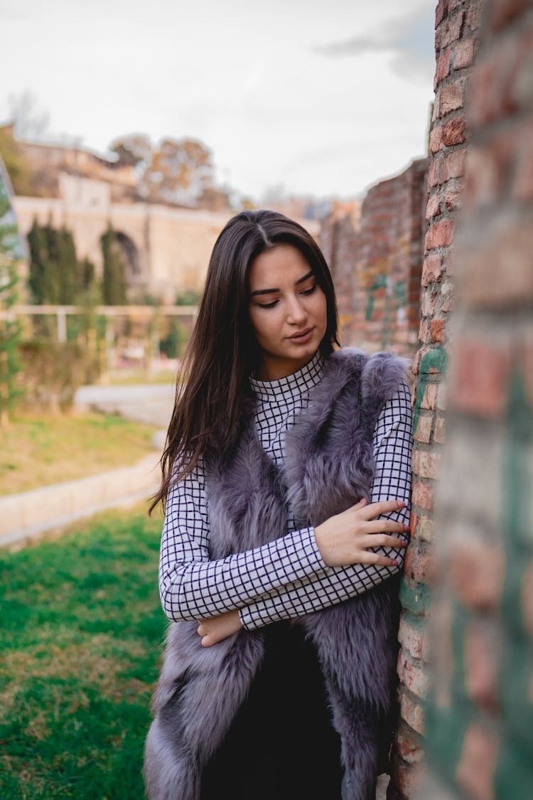 A Woman In A Faux Fur Vest 