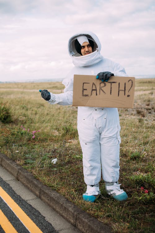 Free Hitchhiking Astronaut Stock Photo