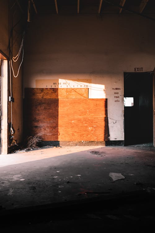 Abandoned building with wooden board