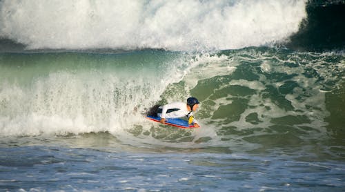 Photo of a Man Surfing