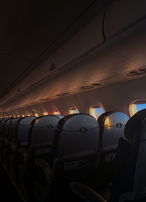 Airplane cabin during a red-eye flight
