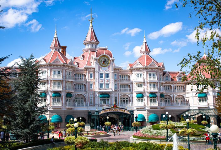 Beautiful hotel entrance at Disneyland Paris with blue sky.
