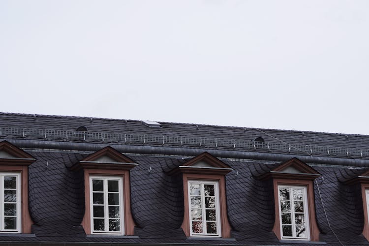 Close-up Of A Windows In The Roof Of A Tenement House