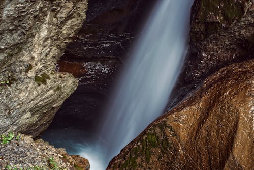 Rapid waterfall streaming in ravine