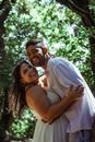 Romantic couple having fun near trees