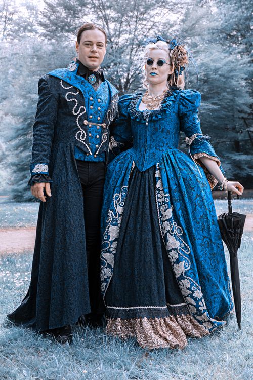 A Woman and a Man Wearing Blue Costumes · Free Stock Photo