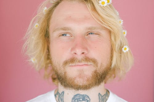 Free Young man with flowers in hair Stock Photo