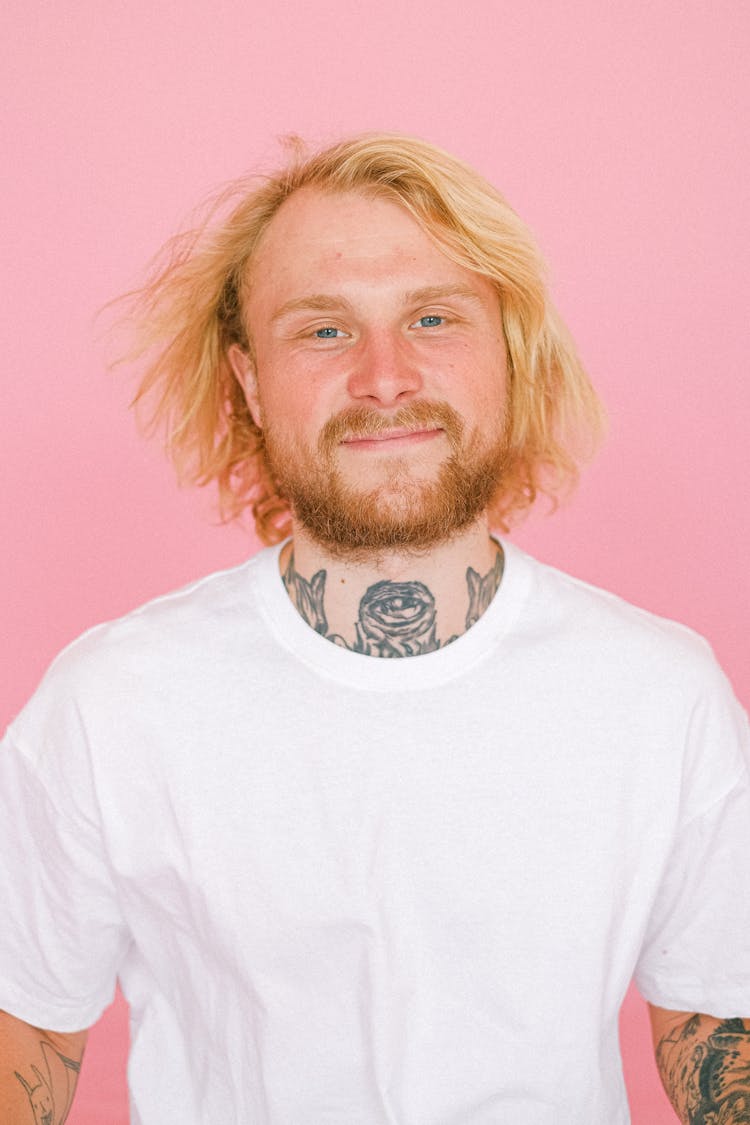 Smiling Young Man With Beard Looking At Camera