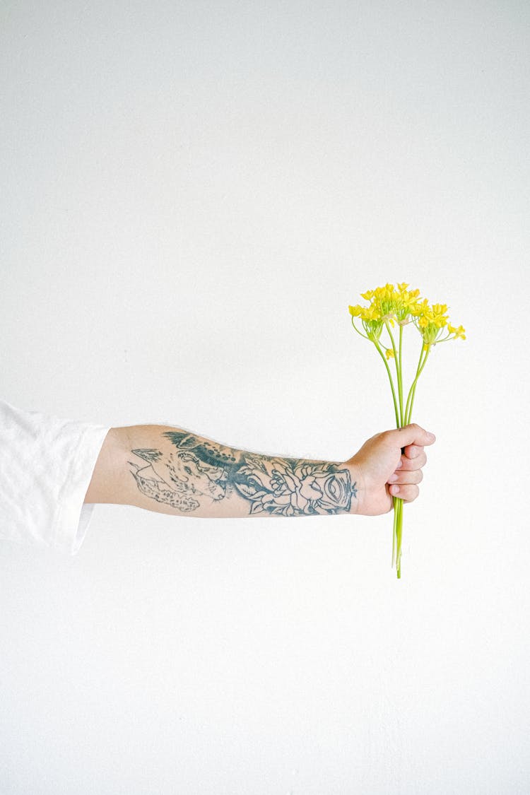 Crop Man With Flower In Hand