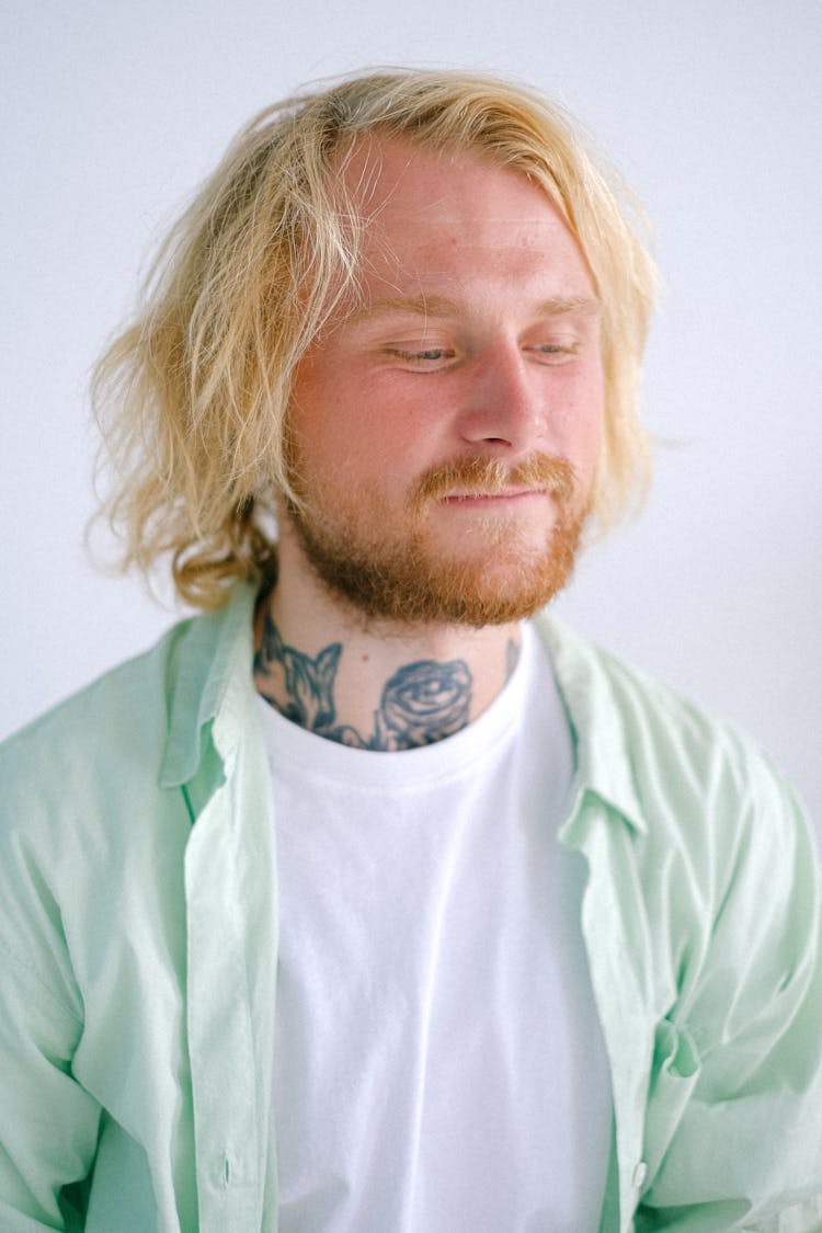 Dreamy Hipster Man In Casual Outfit On White Background