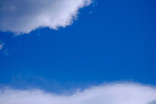 Clouds on bright blue sky at daytime
