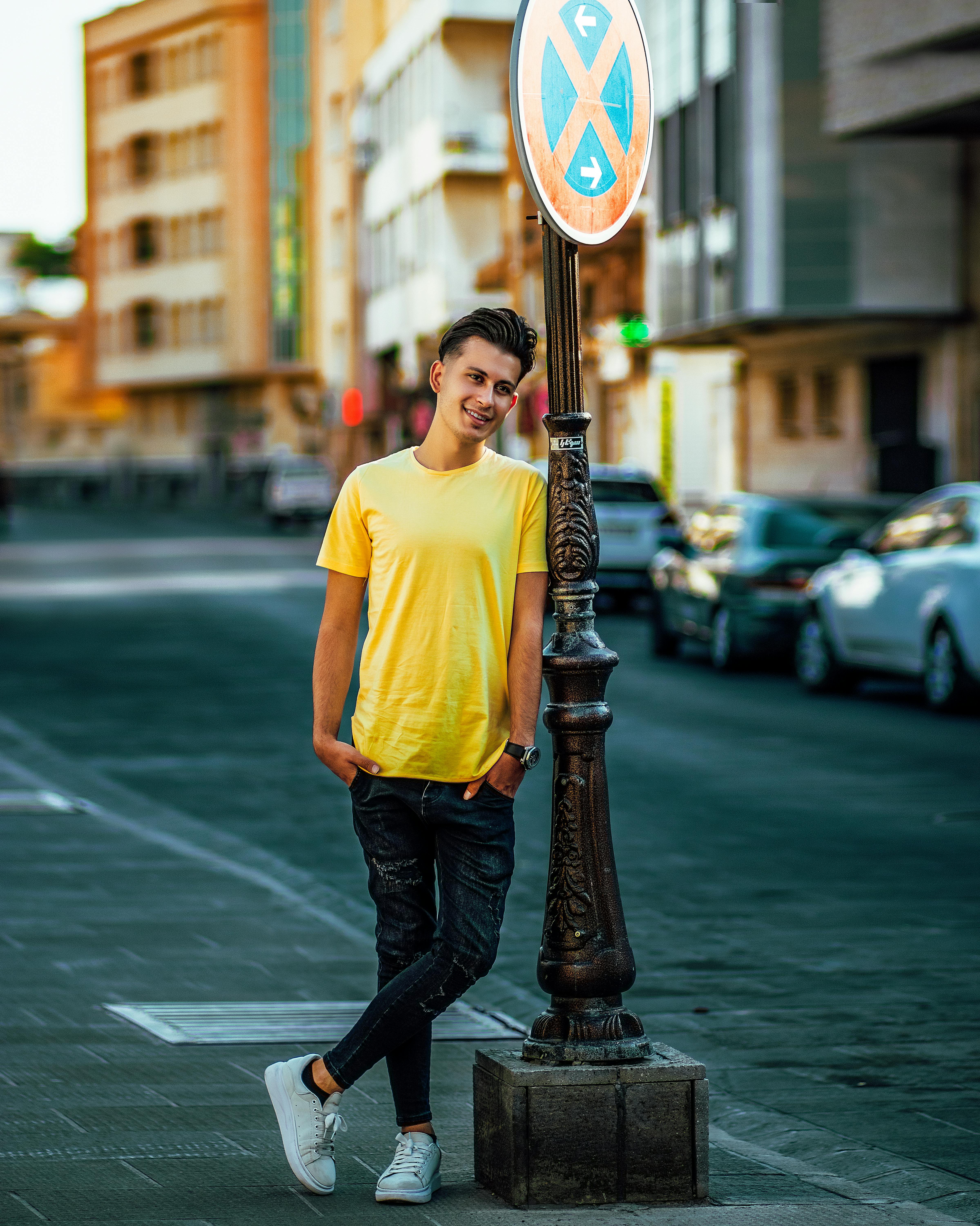 Man Wearing Yellow Crew-neck T-shirt and Blue Denim Jeans · Free