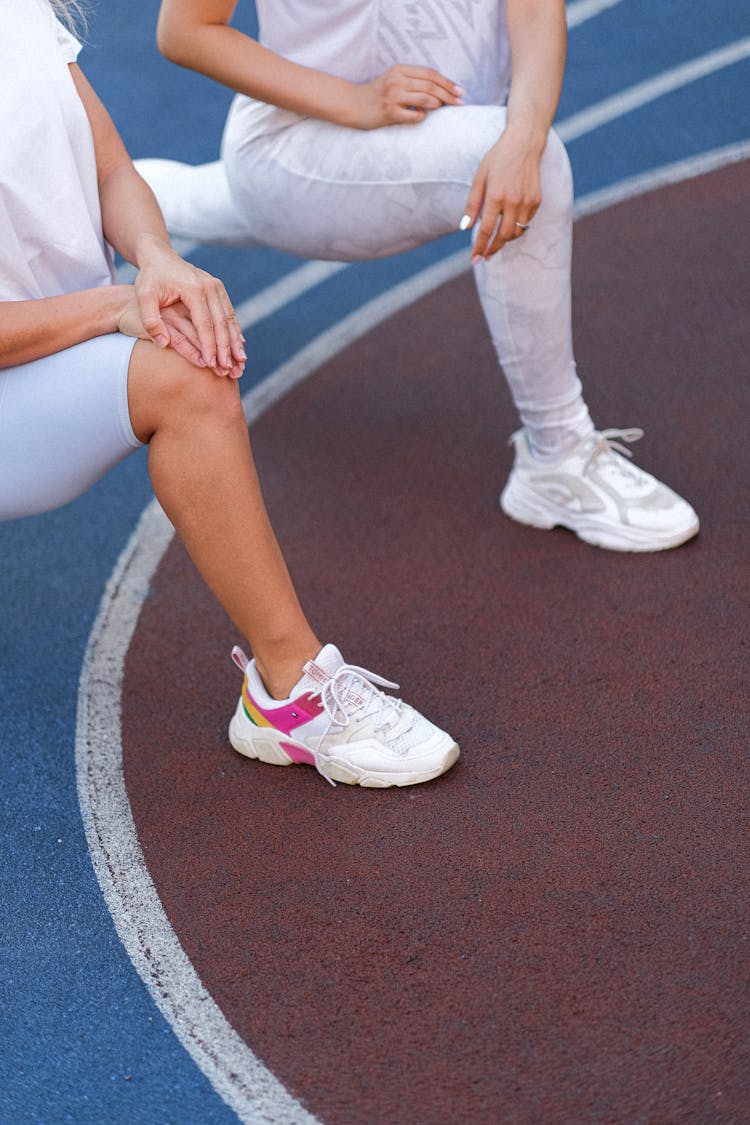 Women Doing Pilates Workout In Sport Field