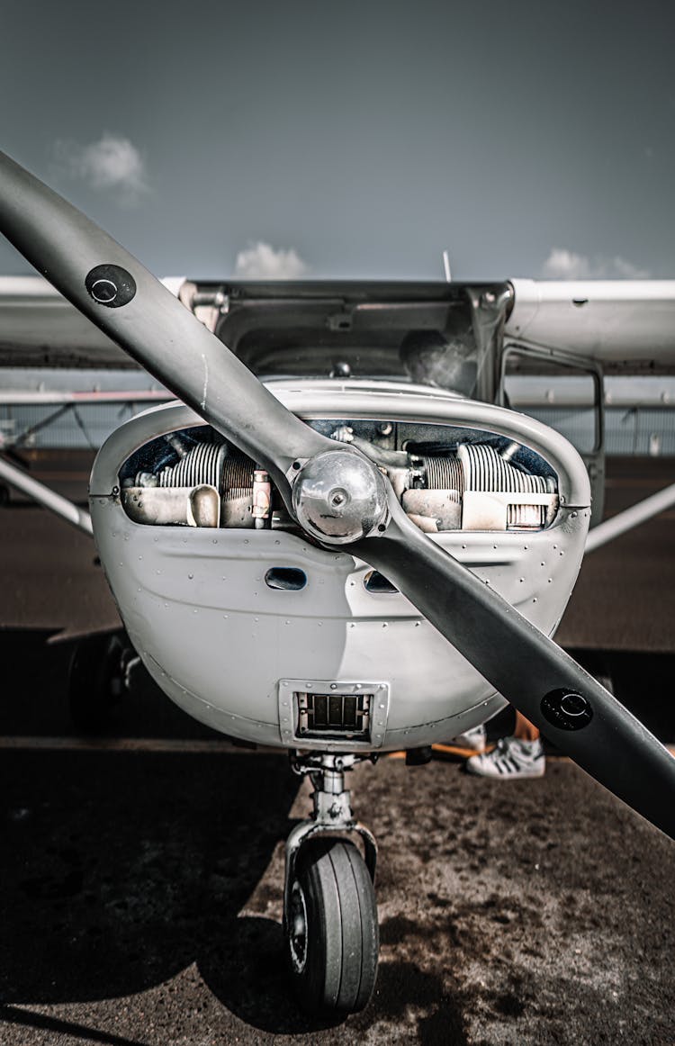 Tricycle Gear Airplane Parked On Airfield