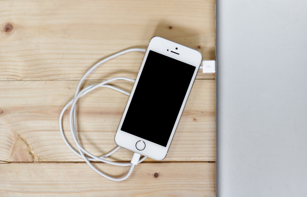 Free Silver Iphone 5s With Cable Stock Photo
