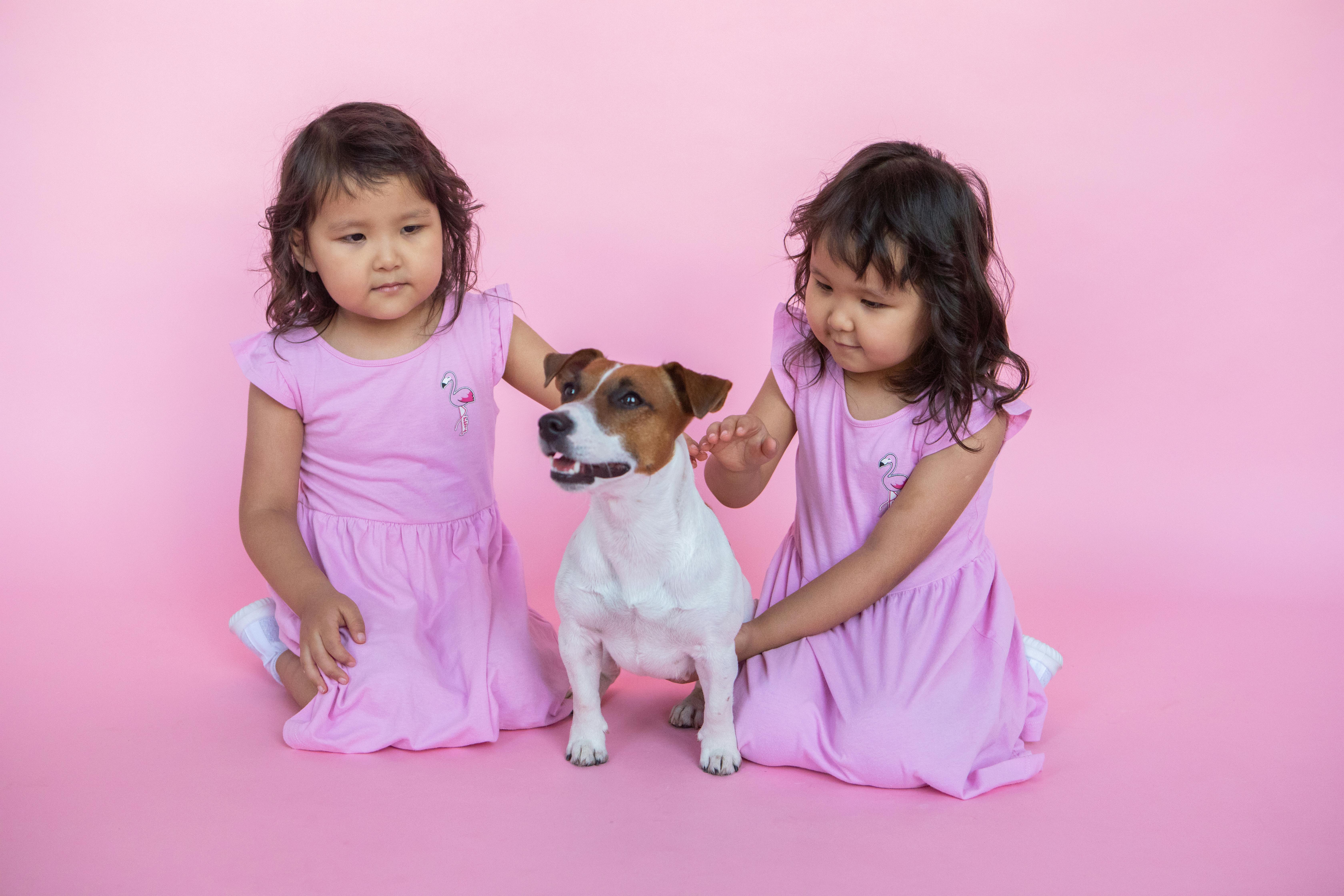 two girls with a dog