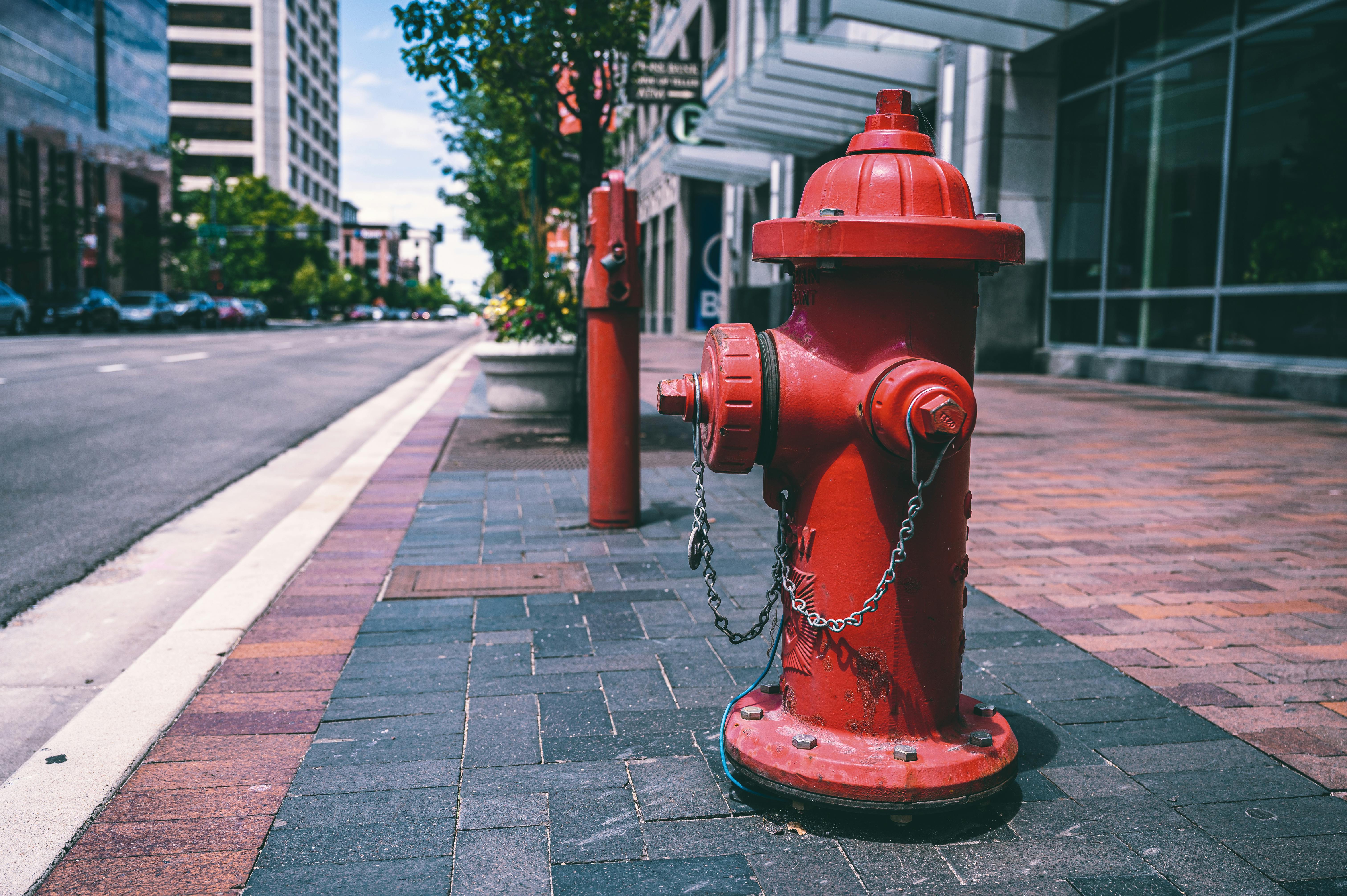 Red fire hydrant on street · Free Stock Photo