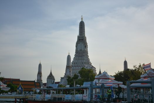 Scenic view of Wat Arun Temple in Bangkok, captured at dusk showcasing its iconic architecture.
